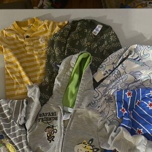 12 months variety. 3 one pieces 1 jacket 2 short sleeve tops. All like new